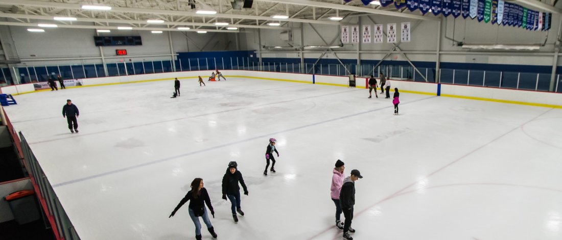 People skating at an ice rink.