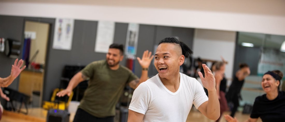 A person dancing in a fitness class.