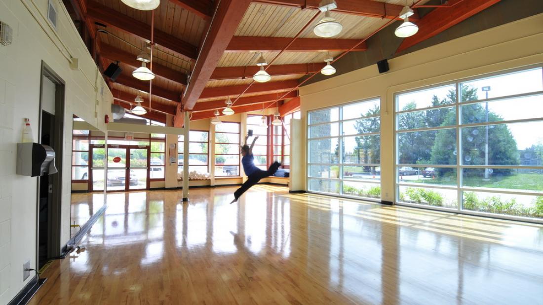 A lone dancer in a dance studio