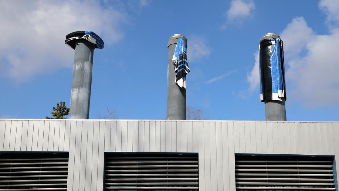 District Energy steam stacks with artwork on top