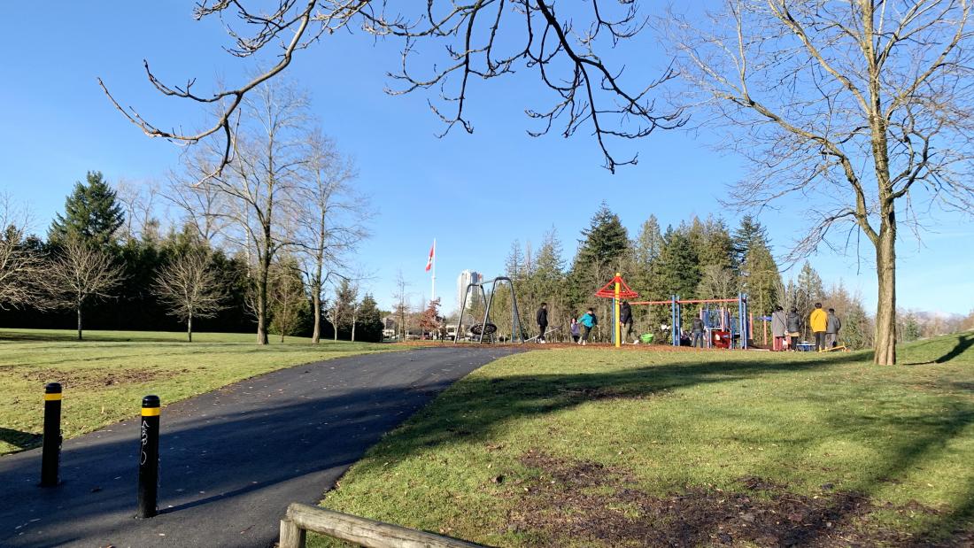 A playground and a paved walking path