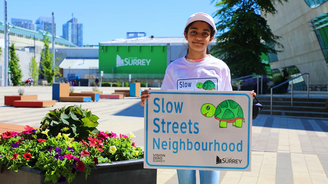 Slow Streets Winner Raisa holding her design