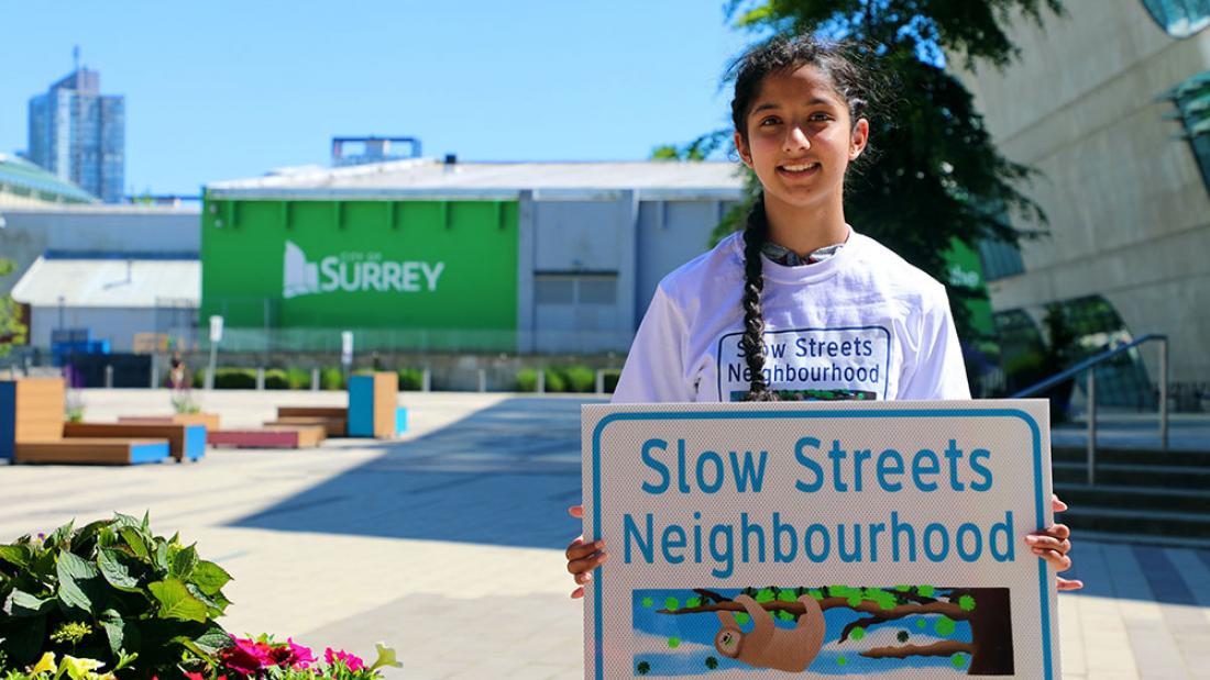 Slow Streets Winner Shubhdeep holding her design