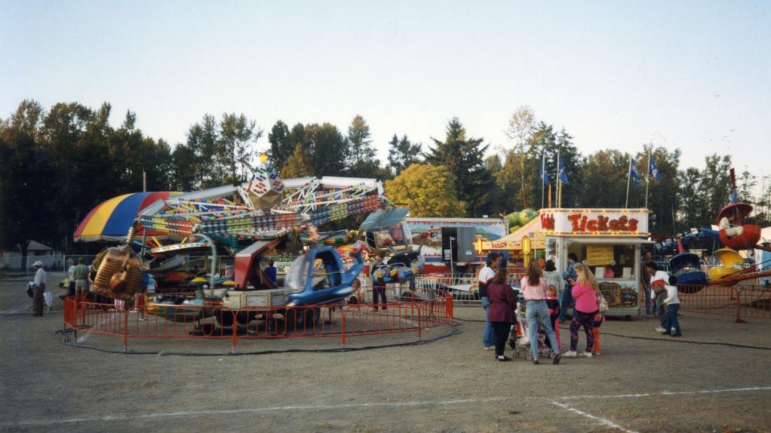Fair rides in the 1980s. Terence William Lyster Collection. Courtesy of Surrey Archives, 2015.0009.148. 