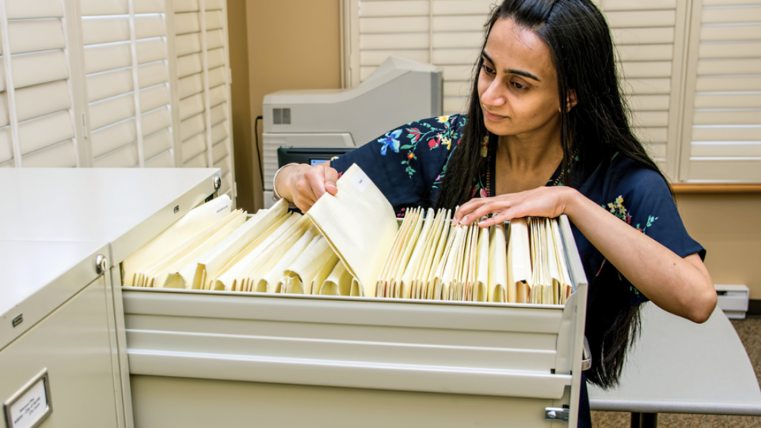 A researcher looking through files
