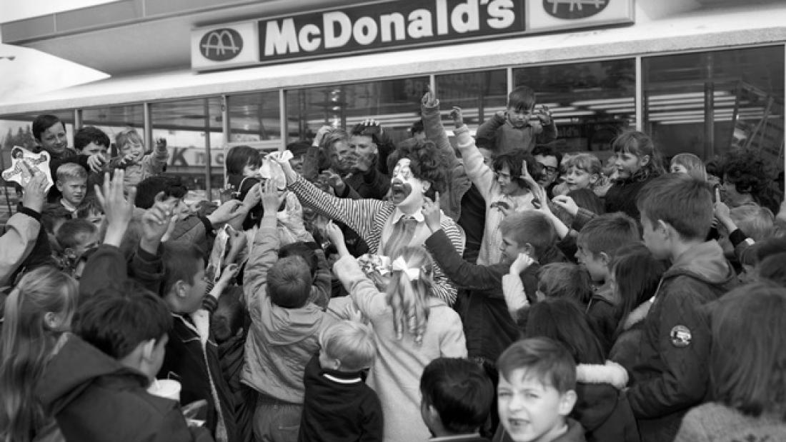 black and white photo of a group outside of mcdonalds. Mcdonald's opening 1967