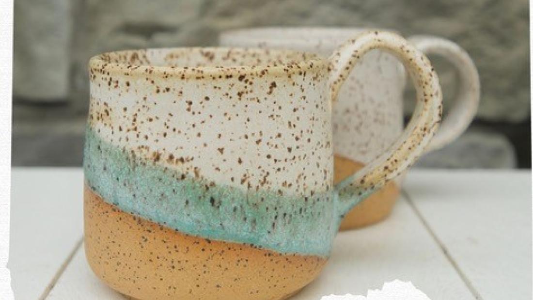 ceramic mugs with white and blue glaze with brown flecks