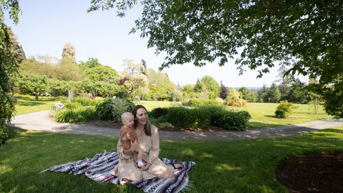 Mother and child sitting in garden