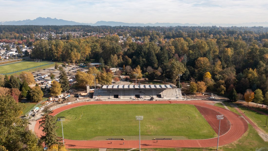 an aerial of a running track and construction on an outdoor stadium