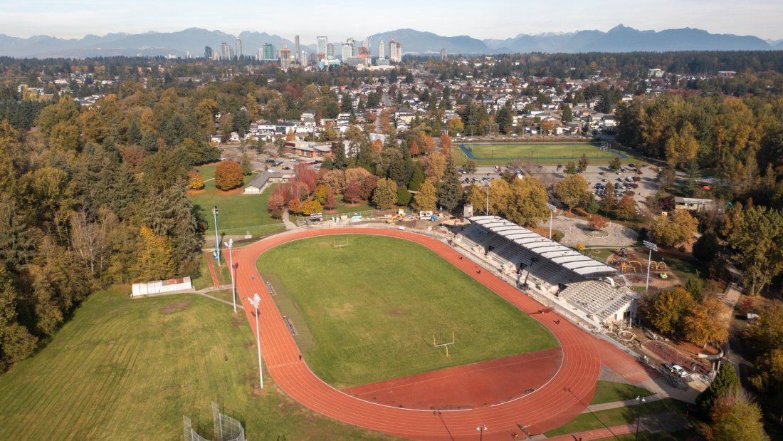 an aerial of a running track and construction on an outdoor stadium