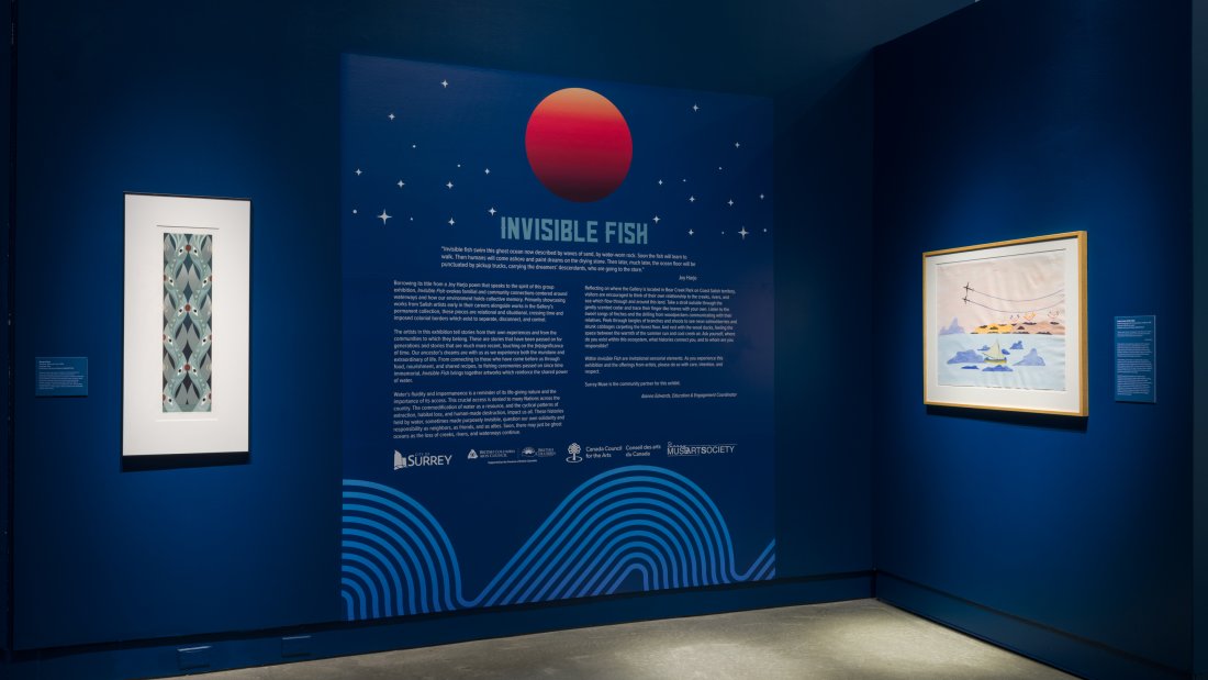 An exhibition wall with intro text along with two artworks.