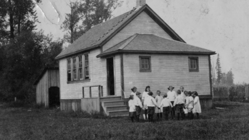 Black and White image of an old schoolhouse