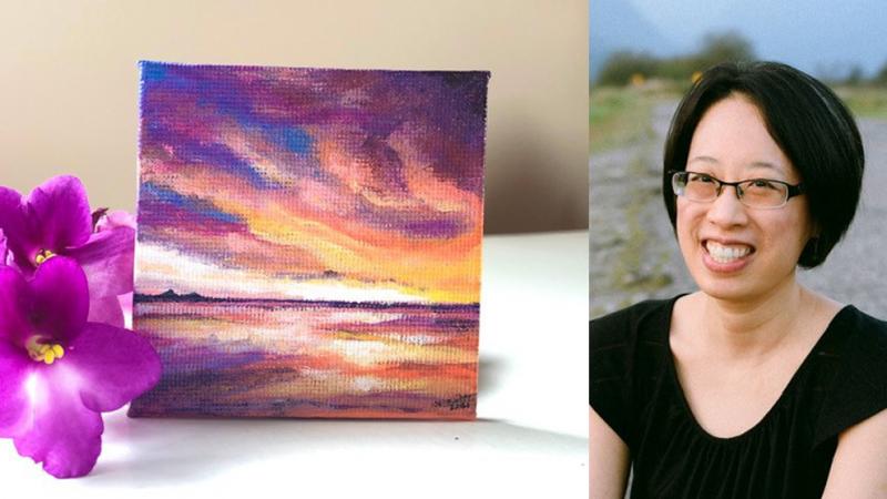 Artist Olive Chan next to one of her 2.5 inch by 2.5 inch acrylic paintings of sunset over water