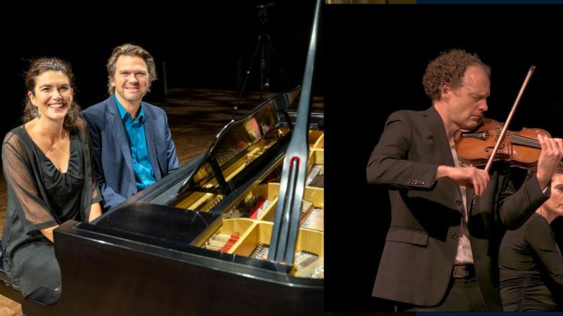 The Bergmann Duo sit smiling at the piano and Jasper Wood plays the violin.