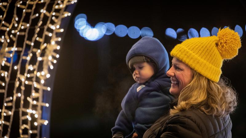 Parent and child looking at lights
