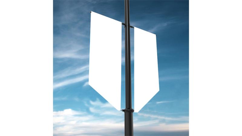 White blank fabric banners attached to a black pole against a cloudy blue sky.