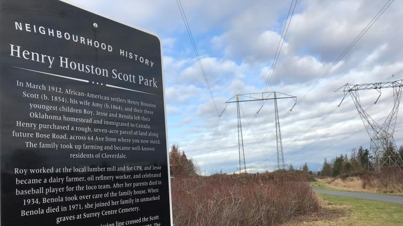 A sign explaining the history of Henry Houston Scott Park