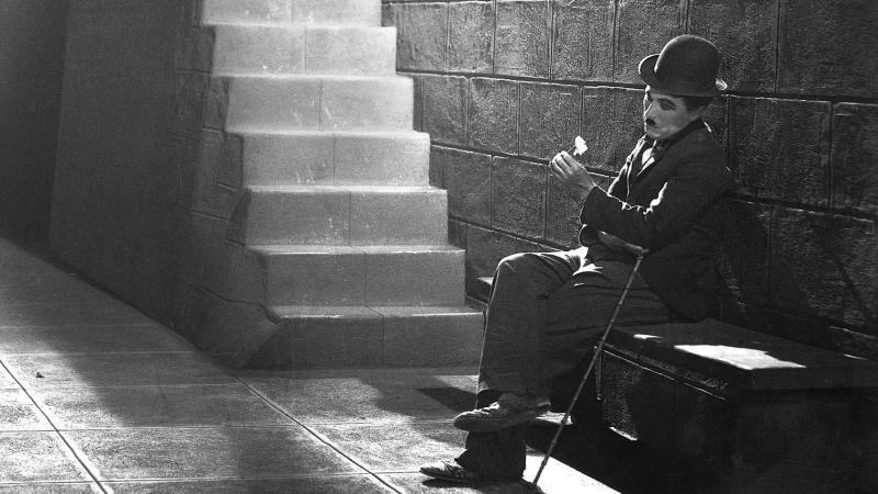 Charlie Chaplin on a bench