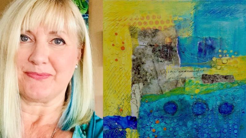 Selfie of artist smiling next to mixed media artwork of blues, yellows, and greens.