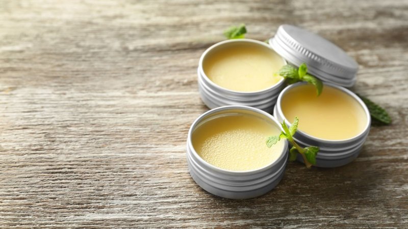 Salves on a rustic table top