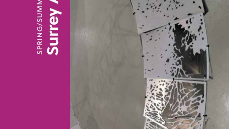 Cover image. White text against dark magenta colour reads: "Spring/Summer 2023 Surrey Art Gallery Engaging Contemporary Art." An image of a metal, circular artwork constructed of panels with lichen-like formations.