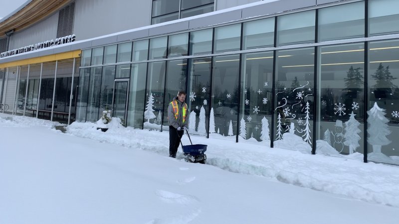 Staff shoveling snow.