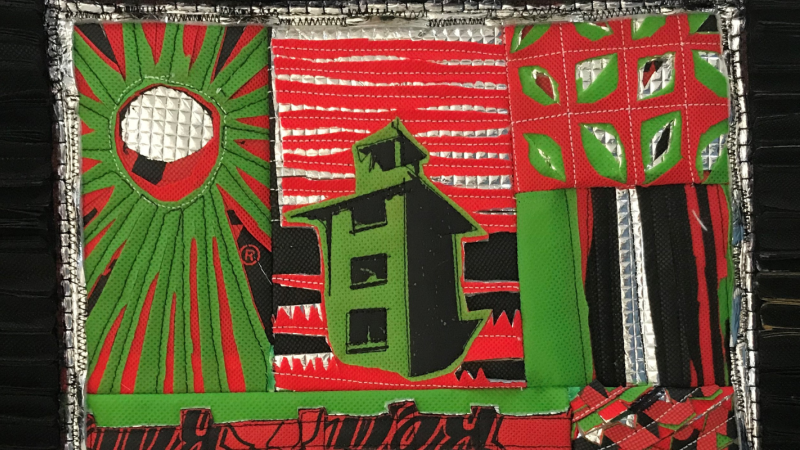 A black frame shows a collage made up of vivid green, red, and black colours. At the centre is a building with three floors and an attic. On the left, appears a sun with rays. On the right, appears a pattern of nuts with long bands of colour.