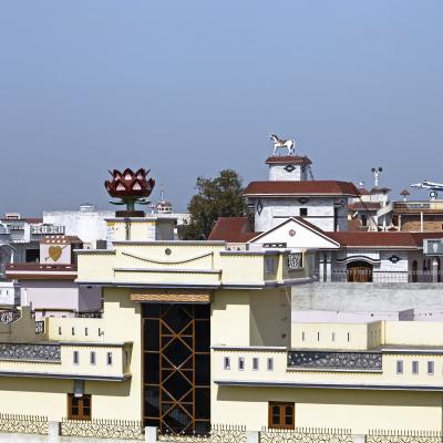 Photograph of houses in India's Punjab with decorative sculptures on the roofs.