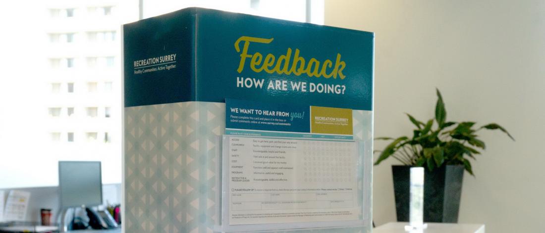 A comment card box on a reception desk