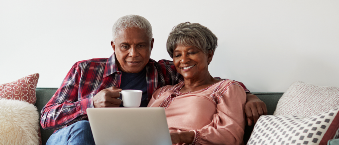 A seniors couple on their computer. 