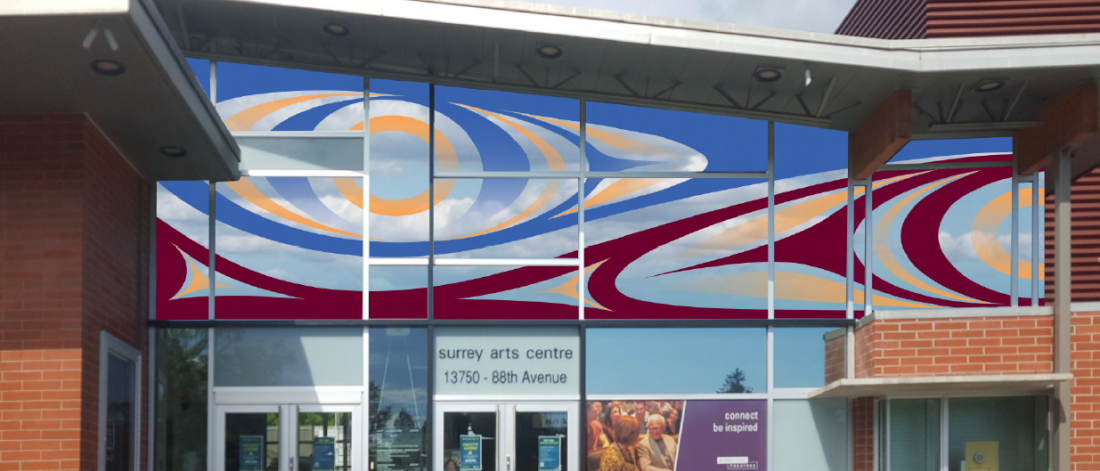 Photograph of a red, blue, and yellow mural of Coast Salish design elements covering the top windows of Surrey Arts Centre.