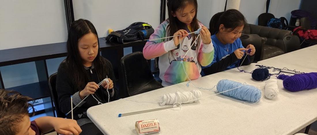 Kids knitting in a MYzone class.