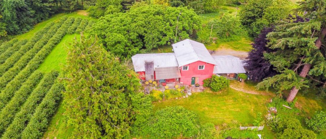 An aerial image of a red barn.