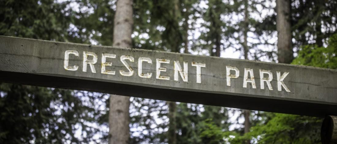 A sign that reads Crescent Park.