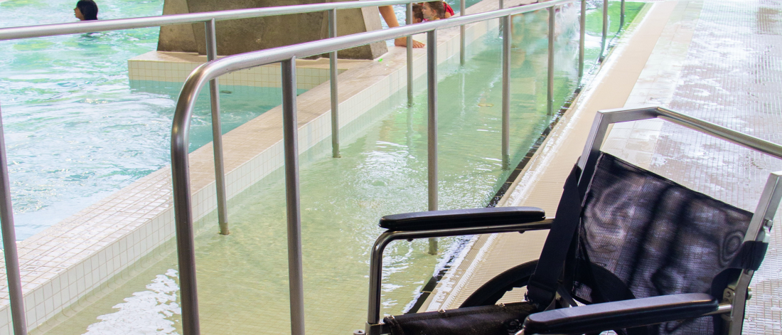Wheelchair and ramp into pool