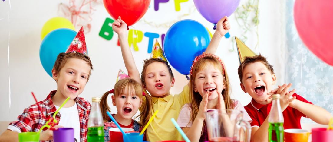 A group of kids having a birthday party,