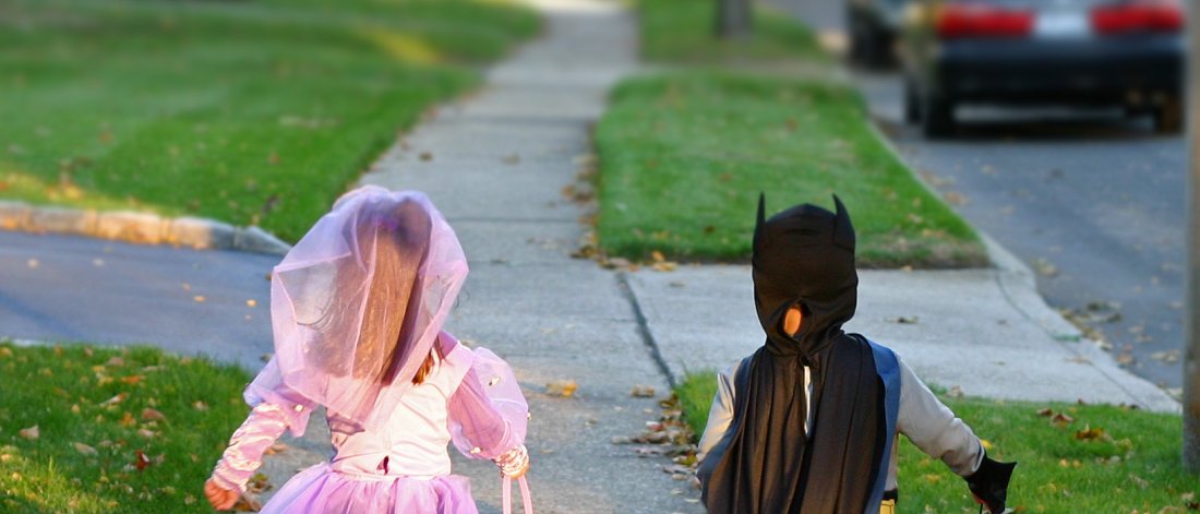 two kids in costumes