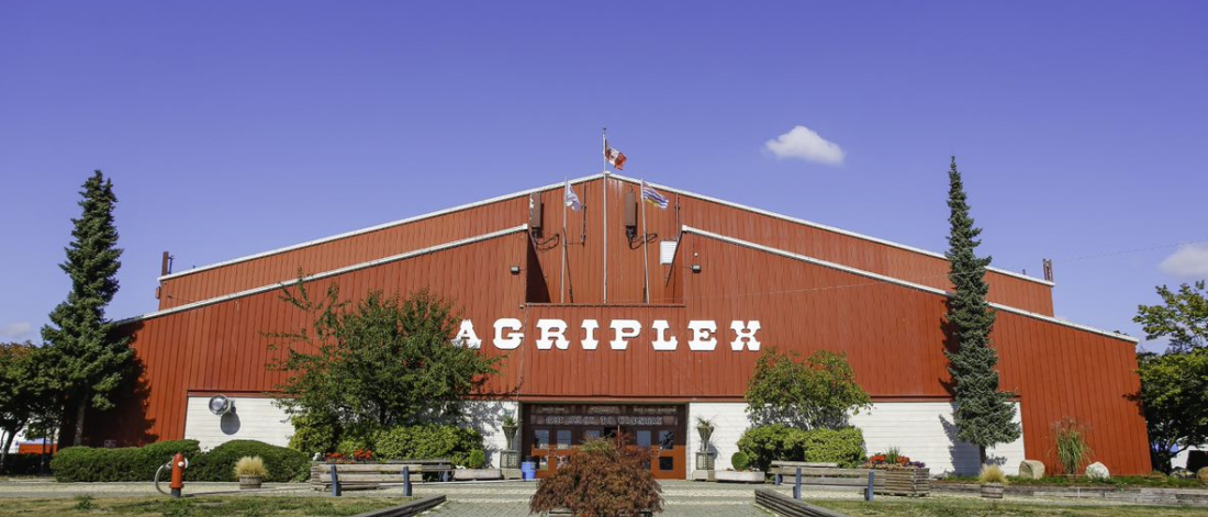 exterior of agriplex building: large red building