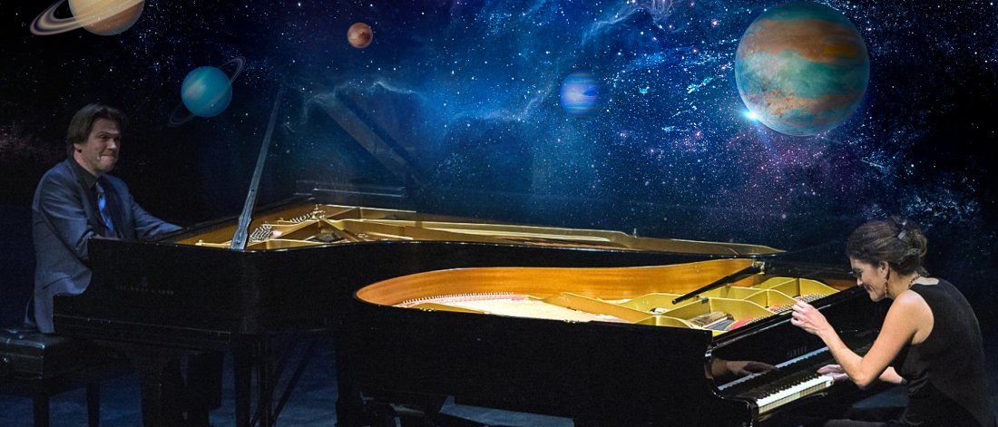 The Bergmann Duo play the piano surrounded by planets