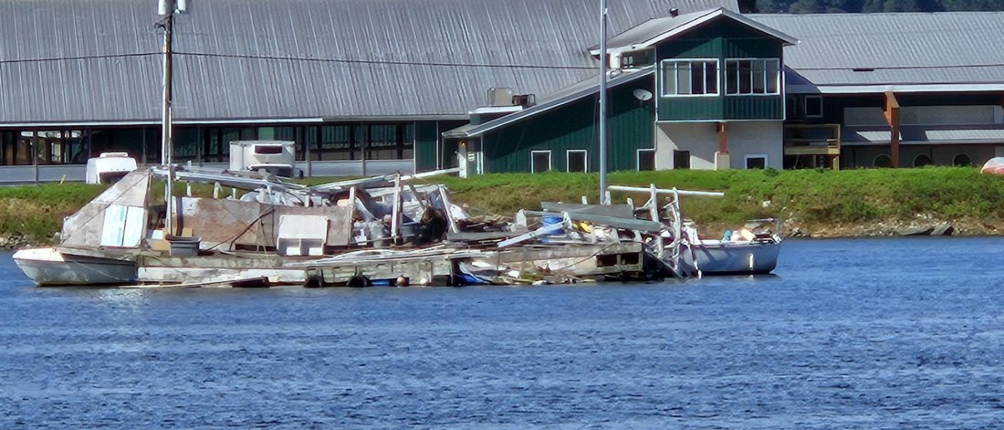 derelict boats on a river