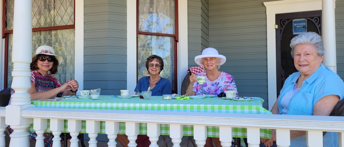 Women enjoying tea on the verandah