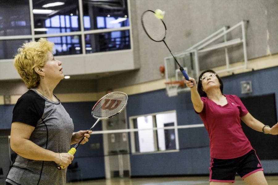 Women playing badminton.