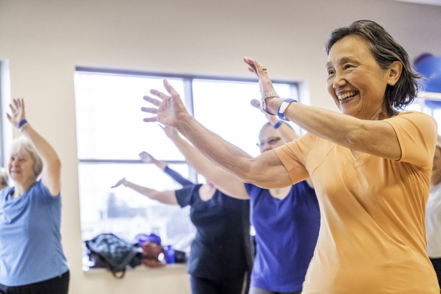 Senior dancing in a fitness class.