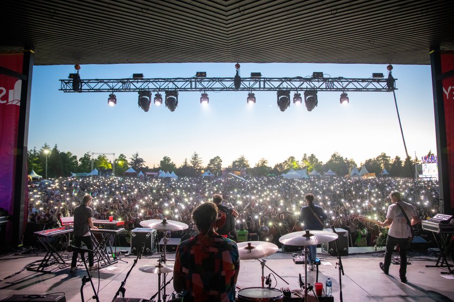 Photo looking at crowd behind Arkells performing on Main Stage at Surrey Canada Day
