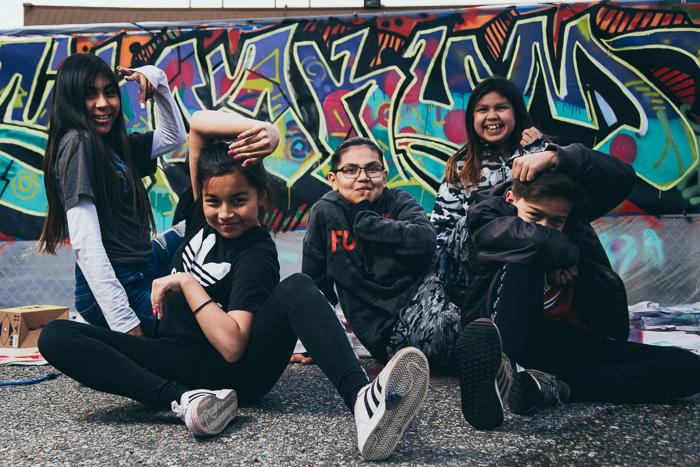 Kids infront of graffiti wall