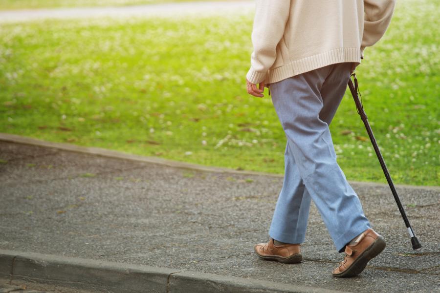 Senior walking with cane