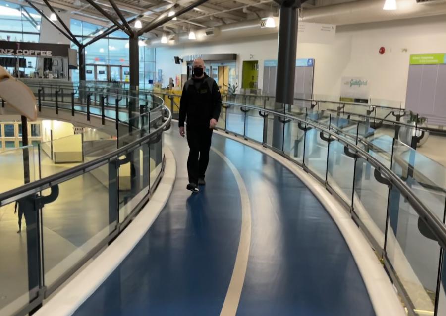 A man on the indoor walking track.