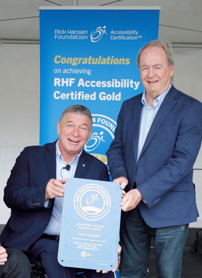 Rick Hansen presents Mayor Doug McCallum with gold certification plaque on May 28, 2019. File photo