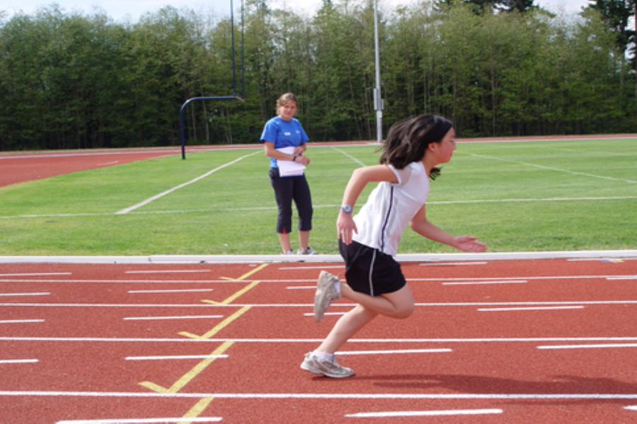 Young girl on a running track