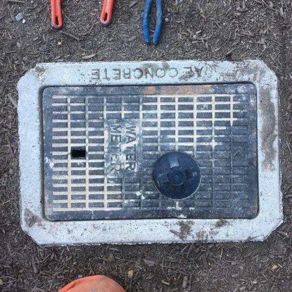 An unobstructed in-ground water meter cover